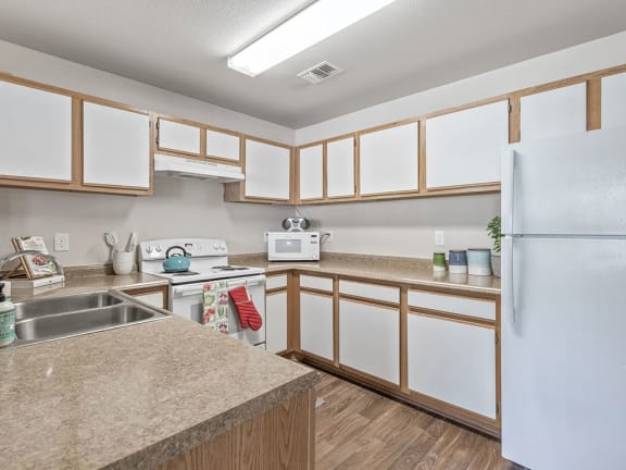 microwave in kitchen at Villas at Bailey Ranch Apartments, Oklahoma, 74055