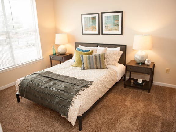 Bedroom With Expansive Windows at Waterford Place Apartments, Memphis, TN
