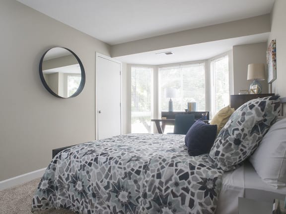 Bedroom With Expansive Windows at The Pointe at St. Joseph Apartments, South Bend
