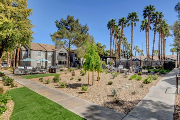 Outdoor seating area with lush landscaping.