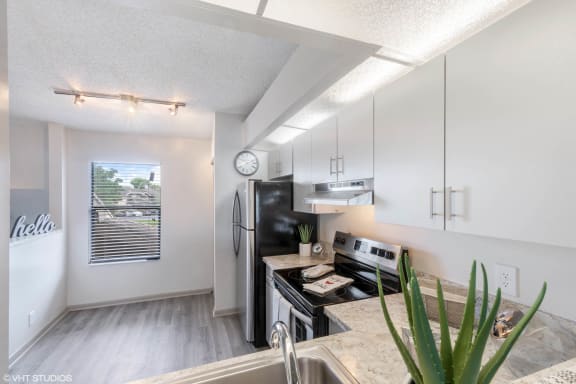Kitchen with Stainless Steel Appliances at Water&#x27;s Edge Apartments, Sunrise, FL, 33351
