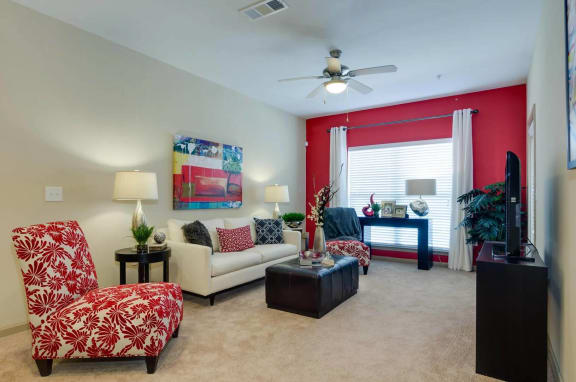 Spacious Living Room Carpeted living room with large windows at Ashley Auburn Pointe in Atlanta, GA