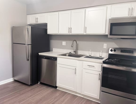 Spacious Kitchen With Pantry Cabinet at The Flats at Seminole Heights, Tampa