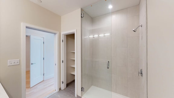 Walk-In Showers With Built-In Bench And Glass Enclosure at Saint James Place, Cambridge, MA