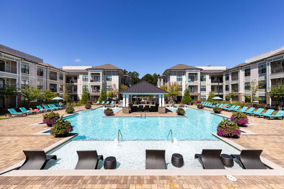 The Juncture Apartments resort-style pool with surrounding sundeck