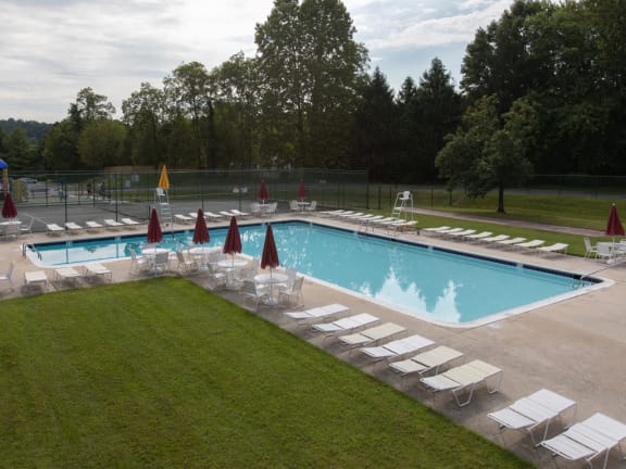 Large swimming pool with lounge area at Cromwell Valley Apartments in Towson, MD