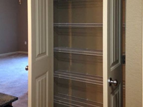 Pantry with built-in wire shelving at Fenwyck Manor Apartments, Chesapeake, VA