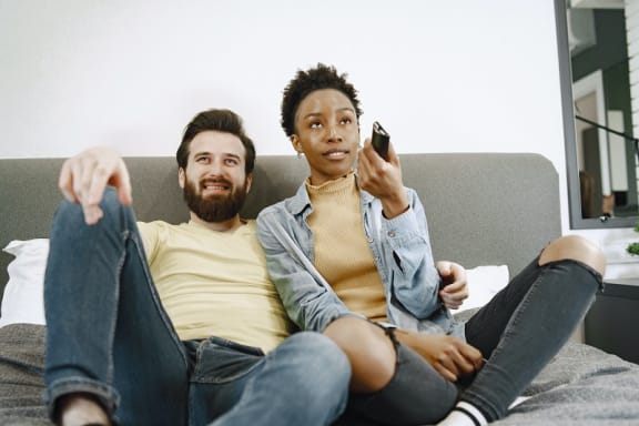 Residents Watching TV at River Pointe Apartments