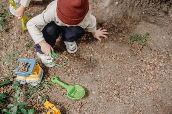 Child Playing in the Playground at The District at Forestville