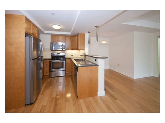Stylish Maple Cabinetry in Kitchens with Laminate, Wood Trimmed Countertops at Marion Square, Massachusetts, 02446