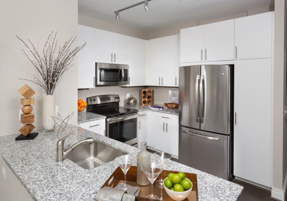 All Electric Kitchen with White Cabinets at Harrison at Reston Town Center, Reston, VA, 20190