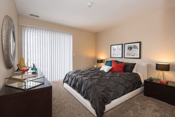 Bedroom With Expansive Windows at Reflection Cove Apartments, Missouri, 63021