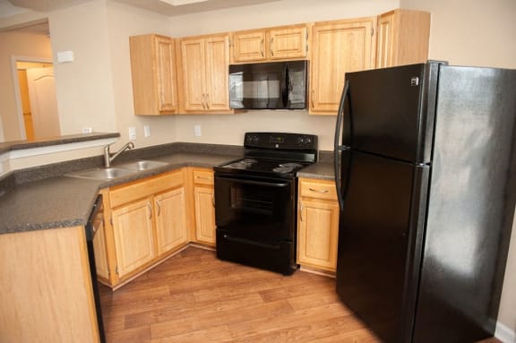Refrigerator in kitchen at Waterford Place Apartments, Memphis, Tennessee