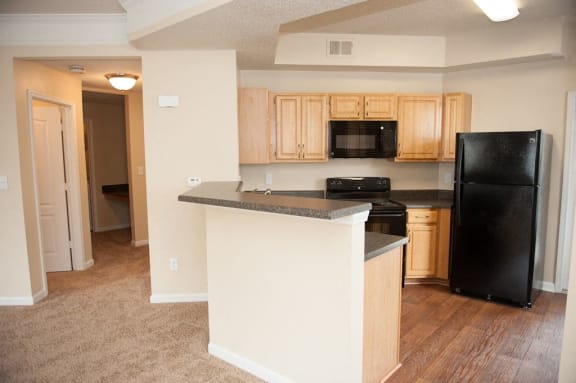 Kitchen Island With Pendent Lights at Waterford Place Apartments, Tennessee, 38125