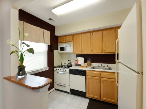 Eat in kitchen with plenty of cabinet space at McDonogh Village Apartments