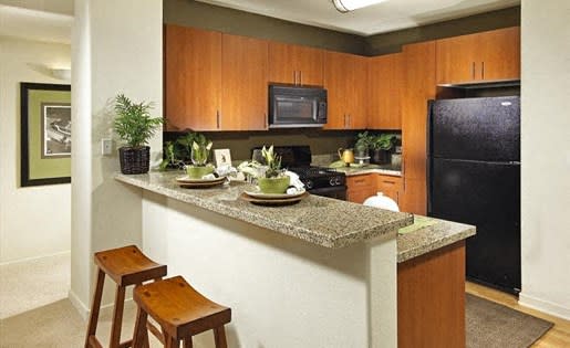 In unit breakfast counters make for an easy place to enjoy a snack. at Trio Apartments, California