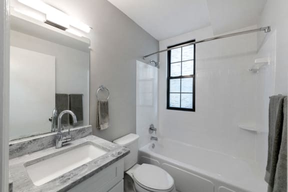 granite vanity and backsplash bathroom sink and shower at Connecticut Plaza Apartments, 2901 Connecticut Ave NW, Washington, District of Columbia, 20008