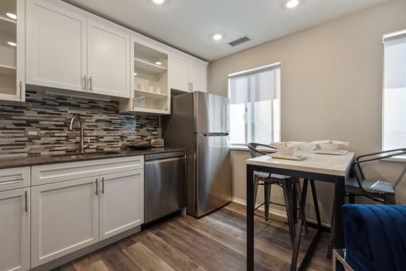 Spacious kitchen with modern backsplash at Park Heights by the Lake Apartments, Chicago, Illinois