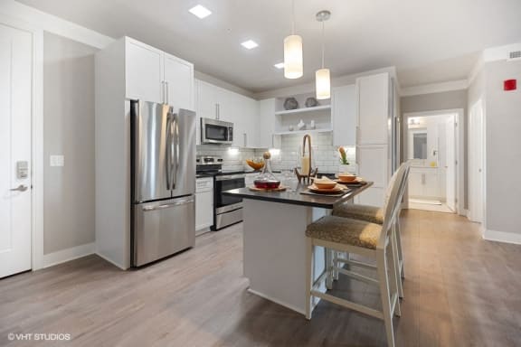 Bright kitchen space with granite countertops