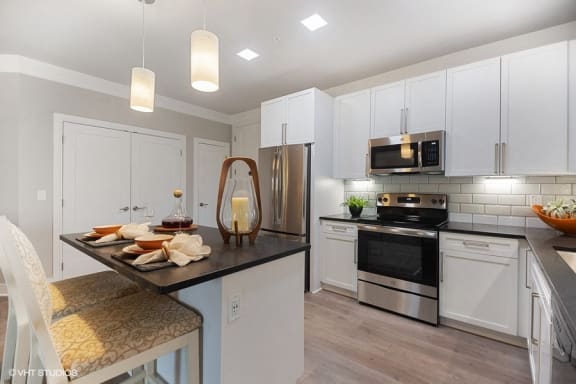 Bright kitchen space with granite countertops