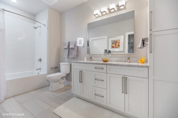 Double vanity and curved shower rod
