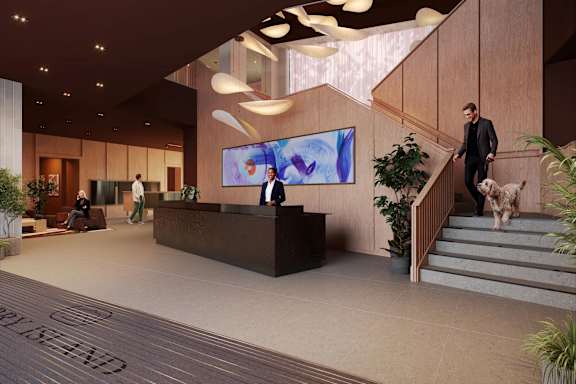 A reception area with a receptionist and a dog.