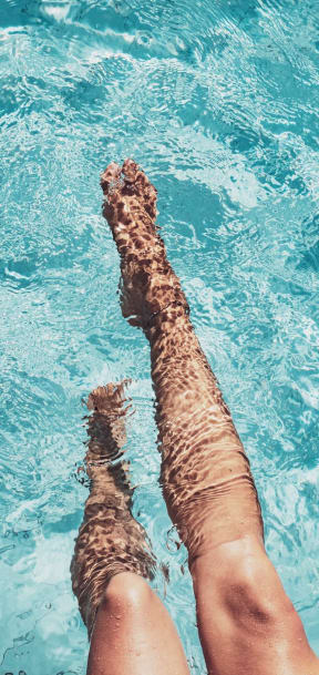 Dipping Toes in Swimming Pool at Carrington Apartments in Fremont, CA 94538