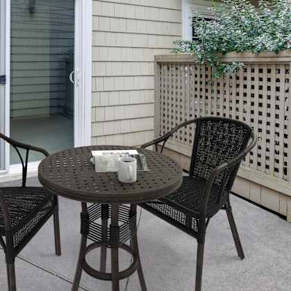 a patio with a table and chairs and a sliding glass door