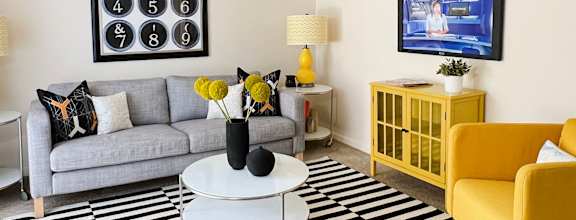 a living room with a couch and a table at Miamisburg by the Mall, Miamisburg, 45342