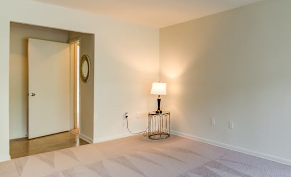 Spacious living room with plush carpeting