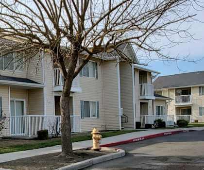 Image of the outside of building next to parking lot