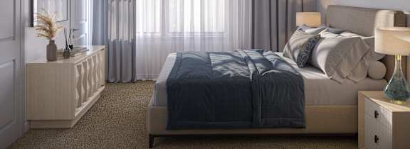 a bedroom with a bed and a ceiling fan