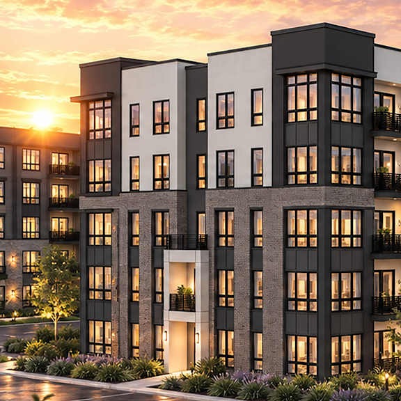 A modern apartment complex with multiple buildings and a parking lot in front.