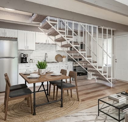 A modern living room with a dining table and chairs.