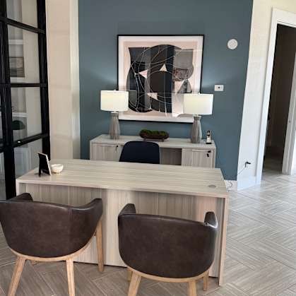 A small room with a chair and a table.
