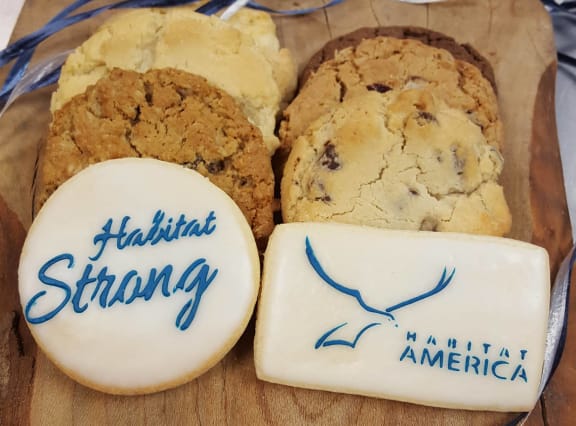 three different types of cookies and a bar of soap on a cutting board