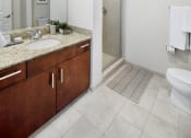 Thumbnail 12 of 27 - a bathroom with a toilet sink and shower at Element, Tampa, FL, 33602