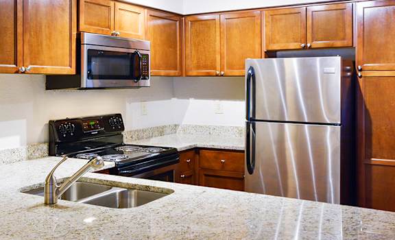 Kitchen with Stainless Steel Appliances at at Apartments in Duluth