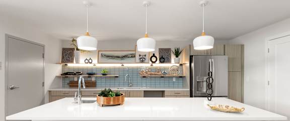 A collage of four different modern kitchen designs.