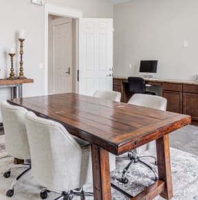 a conference room with a wooden table and chairs