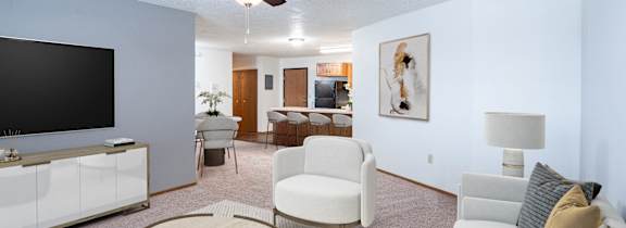 a living room with a couch and a coffee table and a fireplace