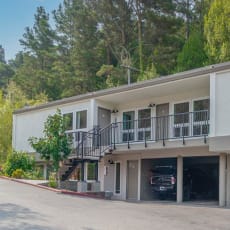 a large building with cars parked in the garage at Trailhead Apartments at Tam Junction, Mill Valley California