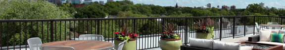the rooftop terrace at the kimpton brice hotel with a view of the min