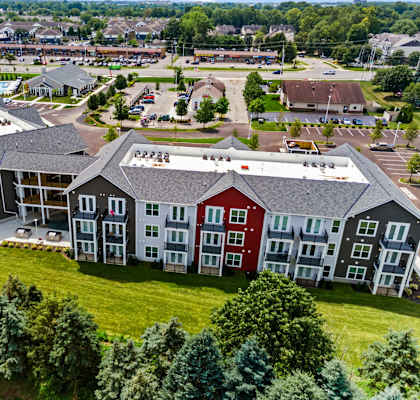 A large building complex with multiple buildings and a parking lot.