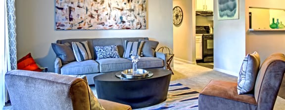 a living room with a couch and a coffee table