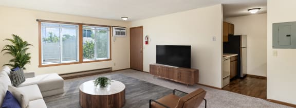 Hutchinson, MN Twin Oaks |a white apartment building with a car parked in front of it