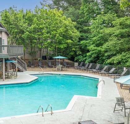 A house with a pool in the backyard.