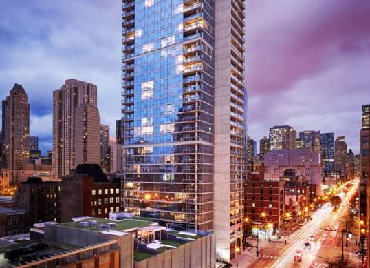 Building Exterior at Dusk at 805 N. Lasalle Drive Apartments Chicago, IL. 60610