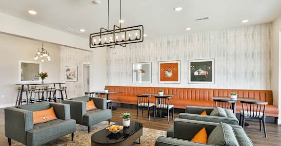 a living room with couches and chairs and a dining room with tables