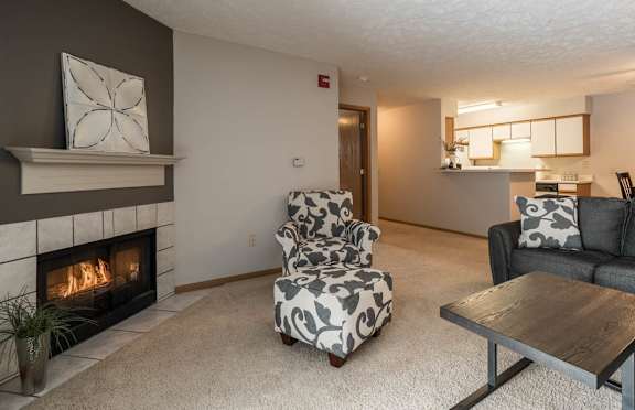 A living room with a fireplace and a couch.